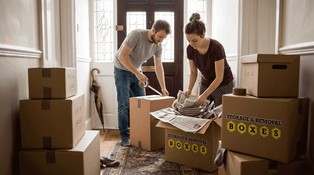 Couple packing with durable moving boxes